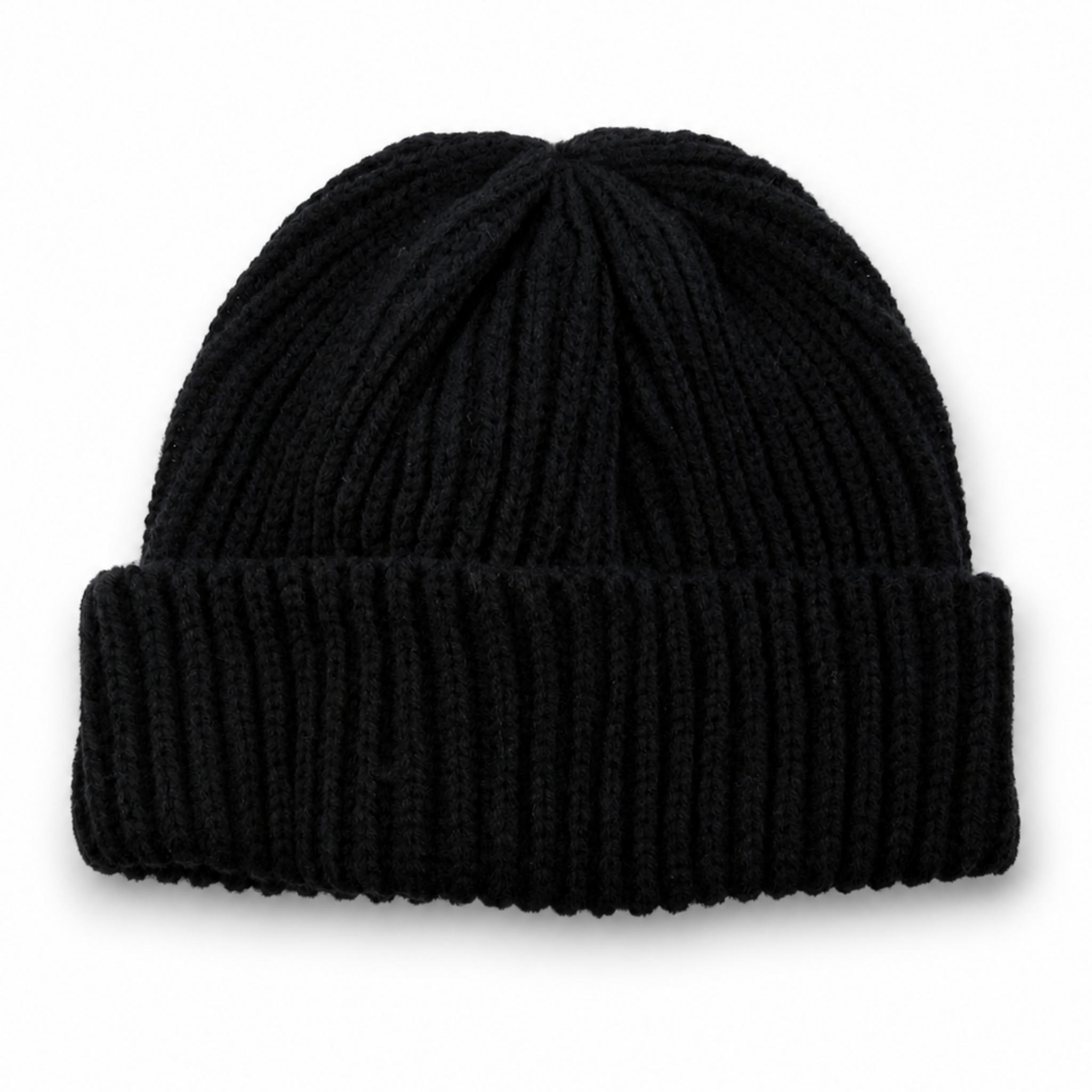 Black ribbed knit beanie with folded cuff on a white background with soft natural shadow.
