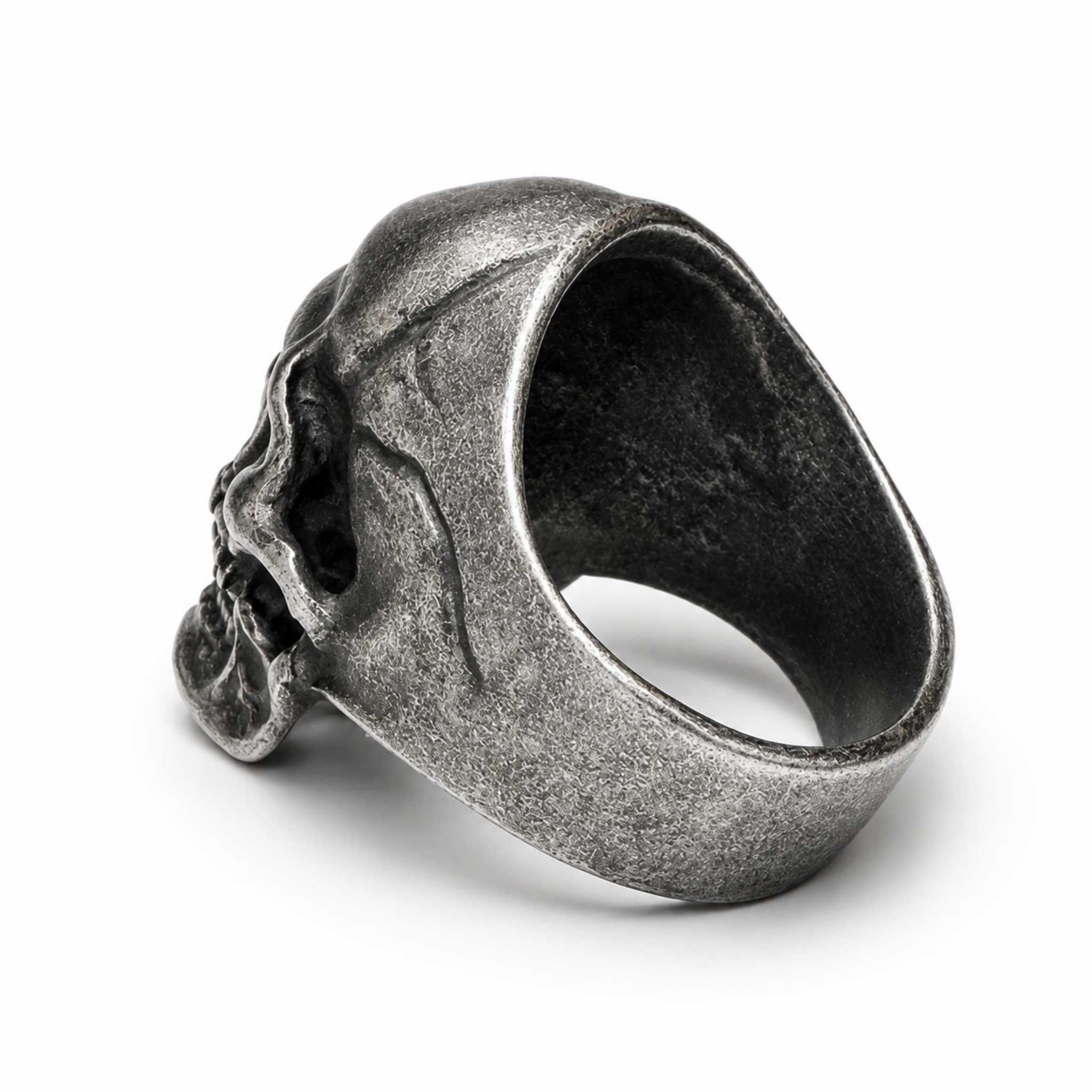 Rear view of a stainless steel skull ring showing the tapered band and textured vintage stainless steel finish on a white background.