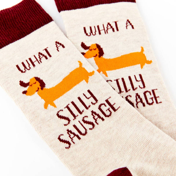 Close up of dog pattern and silly sausage text on socks