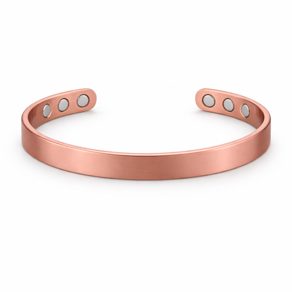 Slim copper magnetic cuff bracelet with plain smooth finish on white background