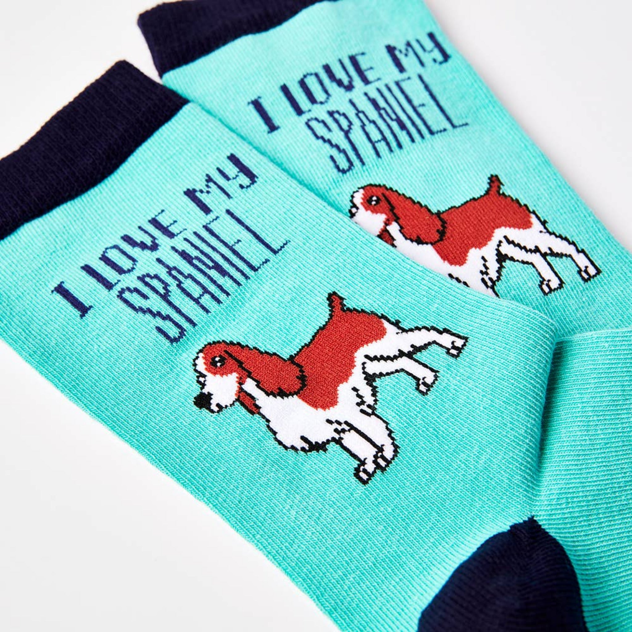 Close up of turquoise spaniel socks showing I love my spaniel text and dog design