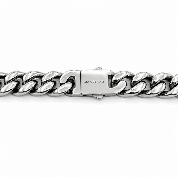 Close-up of the engraved box clasp on a 9mm stainless steel curb chain necklace featuring the Man's Head maker's mark.