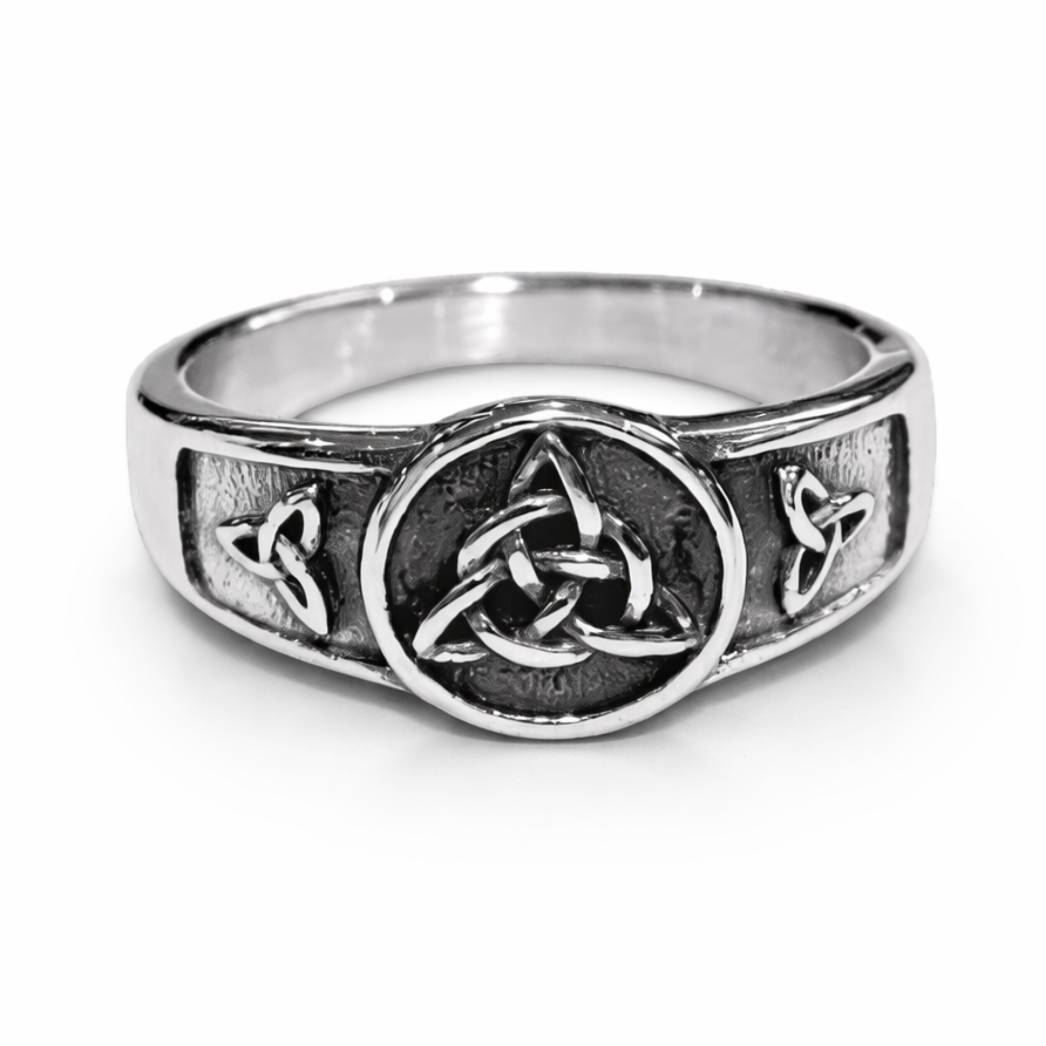 Stainless steel Celtic Triquetra ring with oxidised detailing and polished finish on a white background.