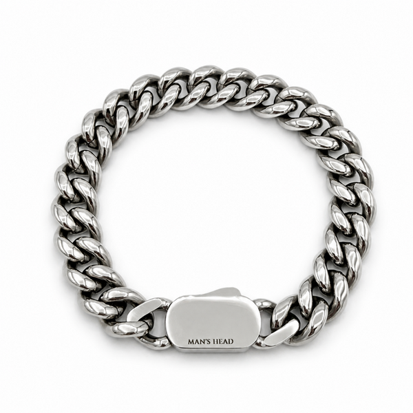 Heavyweight stainless steel 12mm curb chain bracelet with concealed box clasp and polished silver finish on a white background.