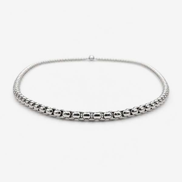 Low angle view of stainless steel 2mm rounded box chain necklace showing thickness and profile