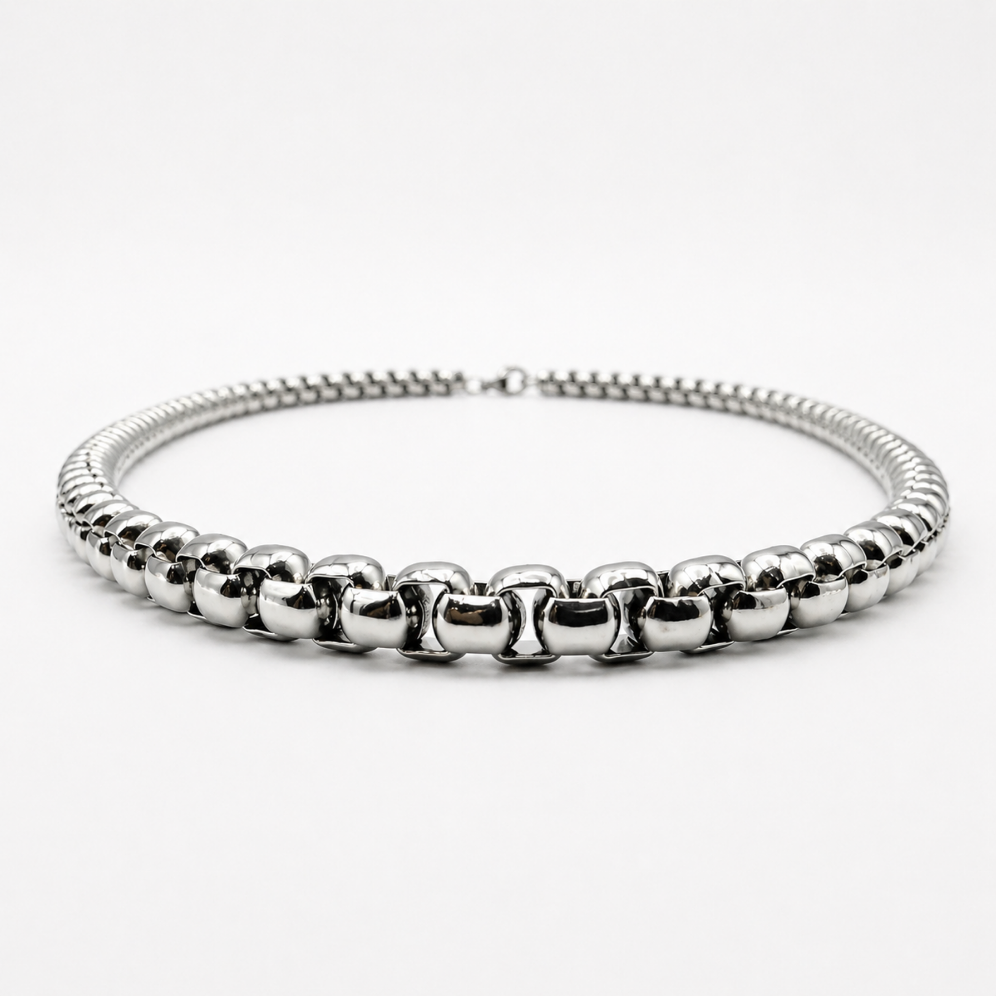 Low angle view of stainless steel 5mm rounded box chain necklace showing thickness and profile