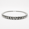 Low angle view of stainless steel 5mm rounded box chain necklace showing thickness and profile
