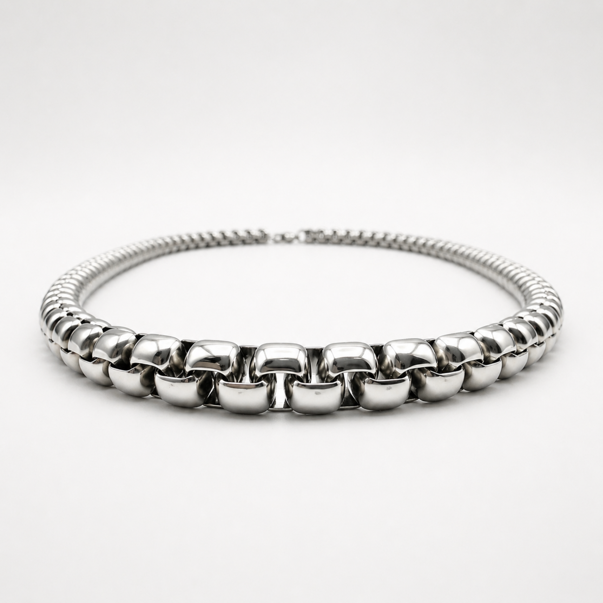 Low angle view of stainless steel 6mm rounded box chain necklace showing thickness and profile