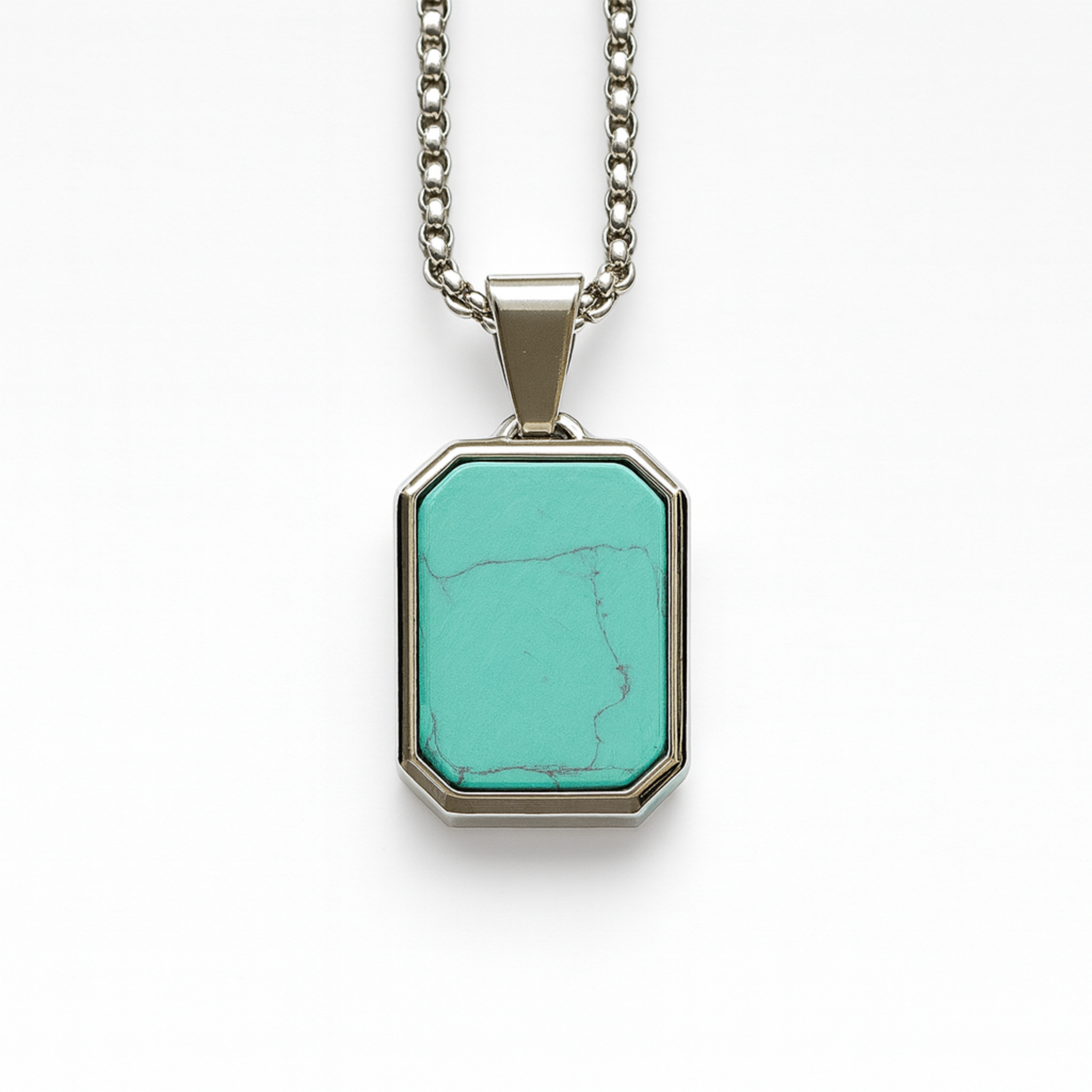 Stainless steel pendant with turquoise stone inlay on 20 inch box chain white background