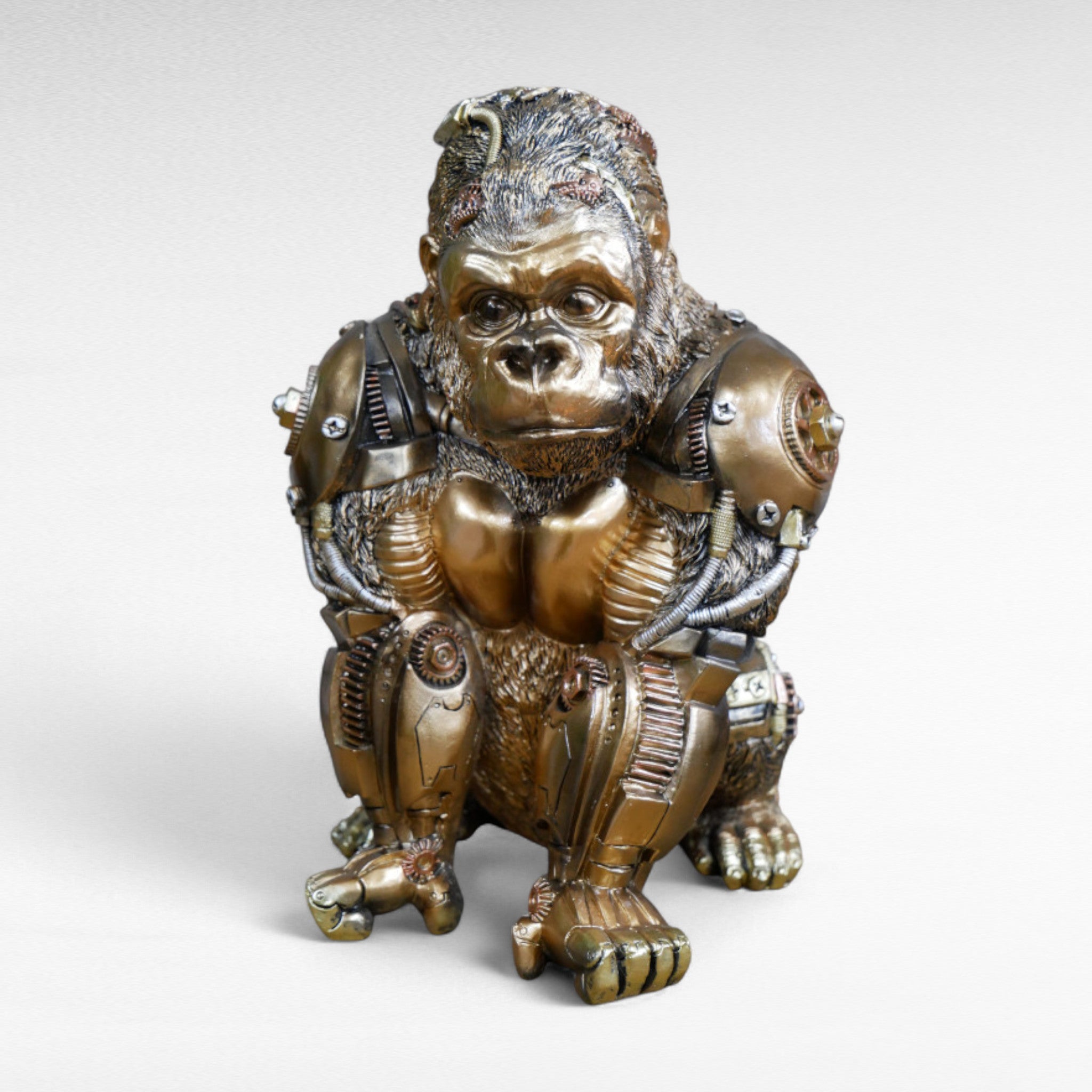 Front view of gold steampunk gorilla ornament with mechanical detailing