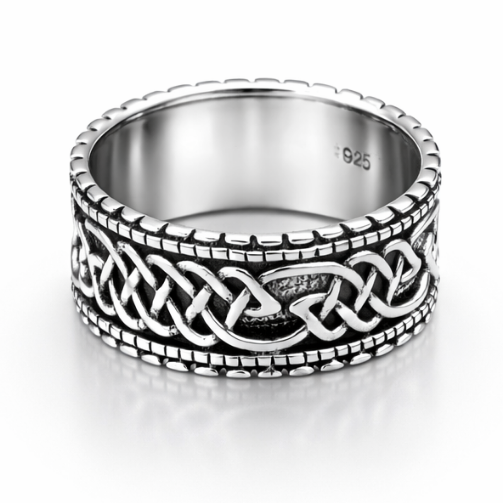 Sterling silver Celtic band ring with oxidised detail and beaded edge on a clean white background