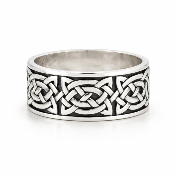 Sterling silver oxidised Celtic knot ring with detailed pattern on a clean white background