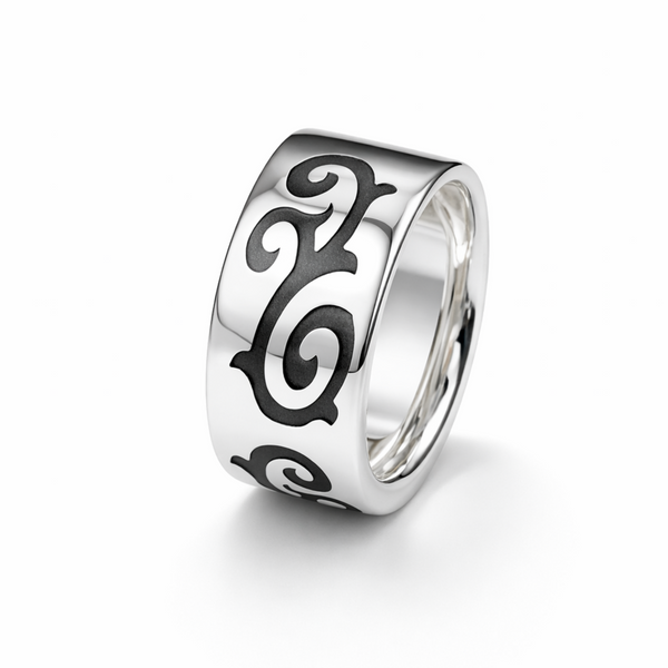 sterling silver tribal scroll ring with oxidised detailing on white background