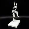 Side view of an officially licensed Stormtrooper Crane Kick figurine balancing on one leg in a martial arts pose on a display base.