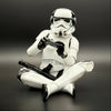 Officially licensed Stormtrooper gamer figurine front view wearing a headset and holding a game controller
