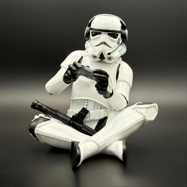 Officially licensed Stormtrooper gamer figurine front view wearing a headset and holding a game controller