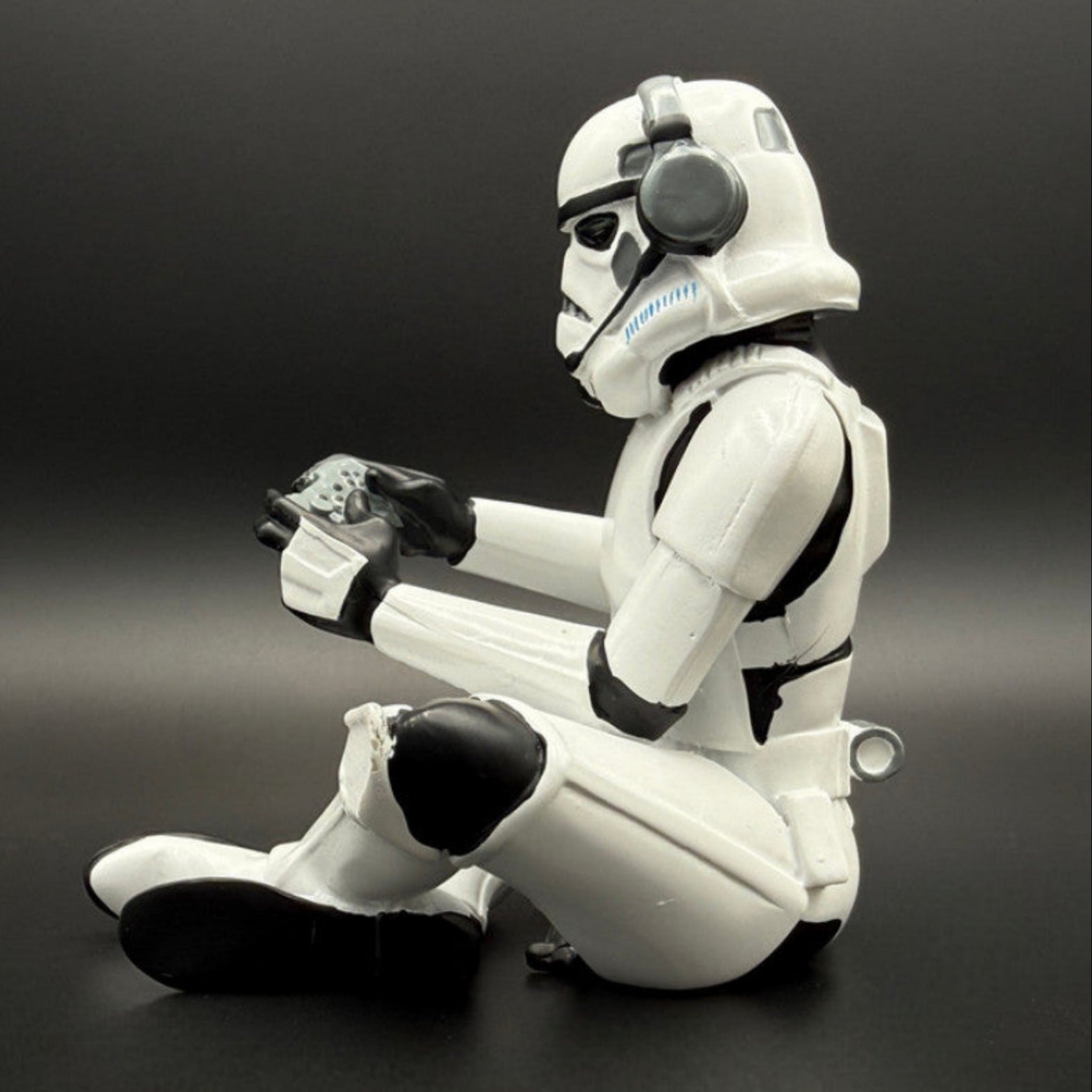 Officially licensed Stormtrooper gamer figurine left side view with headset, controller and blaster detail