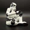 Officially licensed Stormtrooper gamer figurine right side view showing seated gaming pose with headset and controller