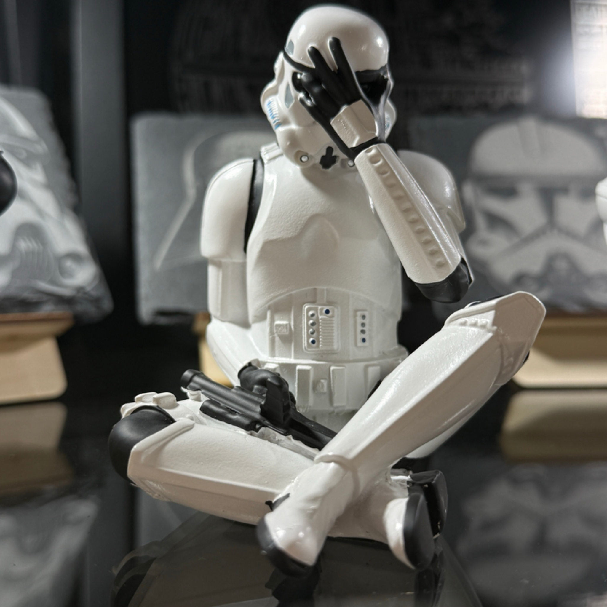 Stormtrooper see no evil figurine 10cm displayed in shop cabinet with other collectible figures
