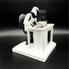 Original Stormtrooper Slave to the Wage figurine side view showing a tired Stormtrooper sitting at an office desk with paperwork and computer