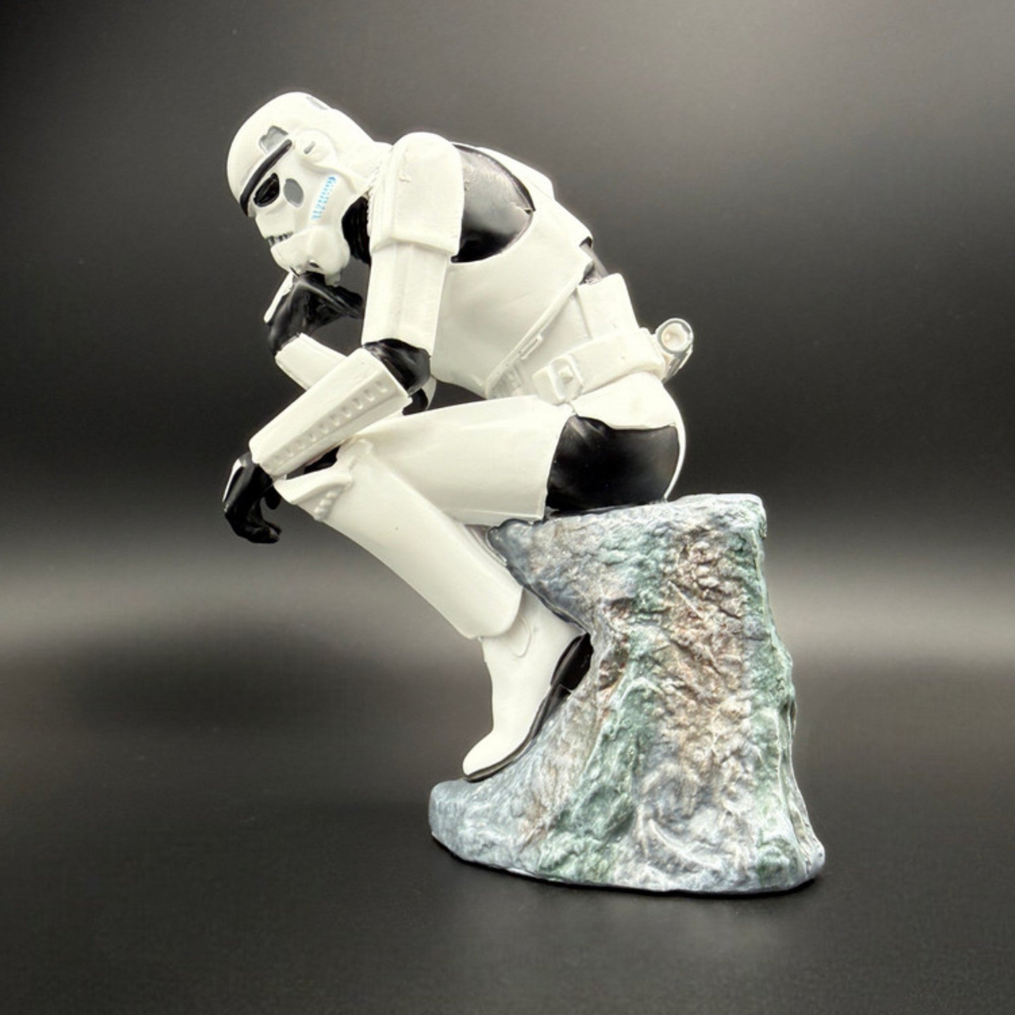 Stormtrooper The Overthinker figurine left side view showing detailed armour and rock base