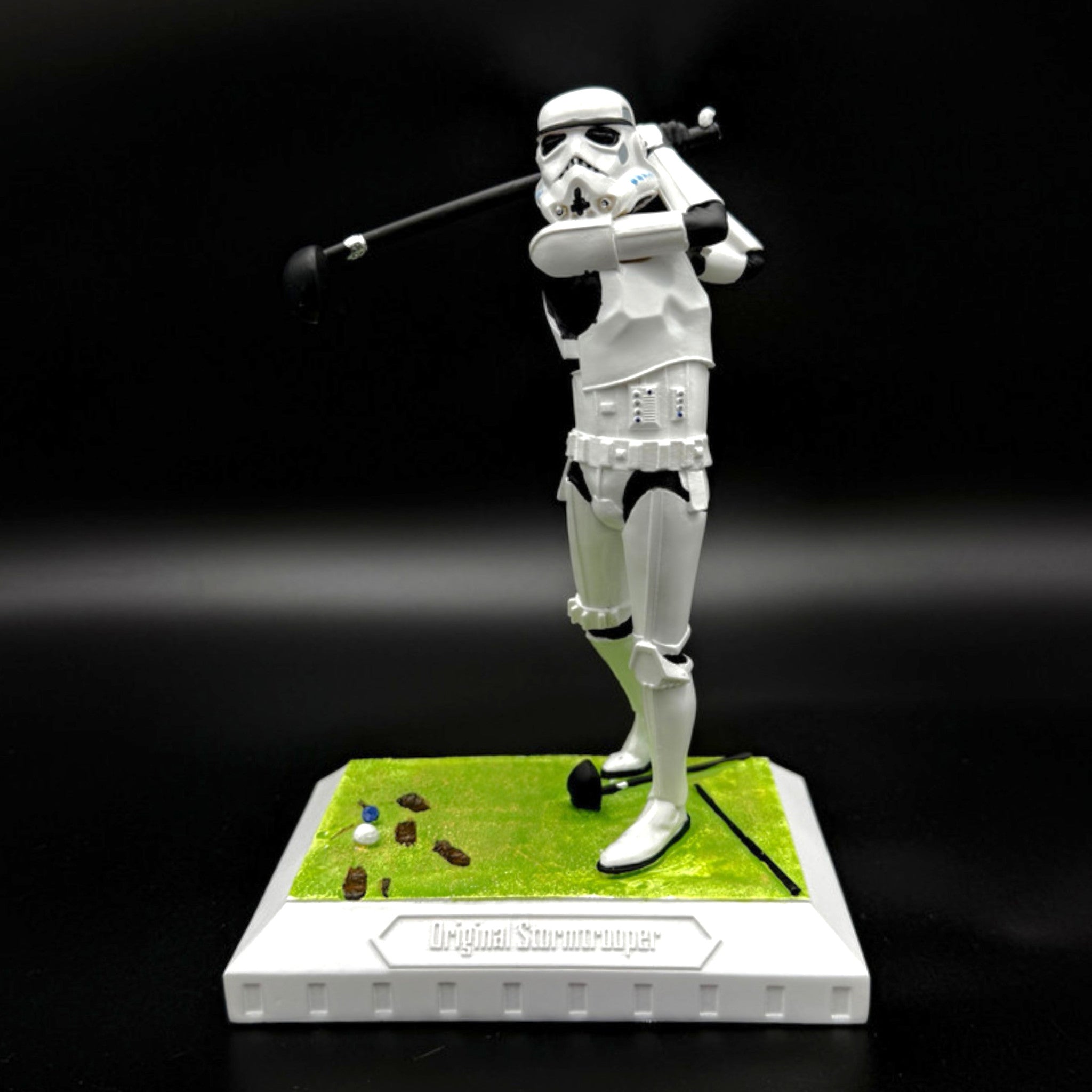 Stormtrooper golf figurine mid-swing front view