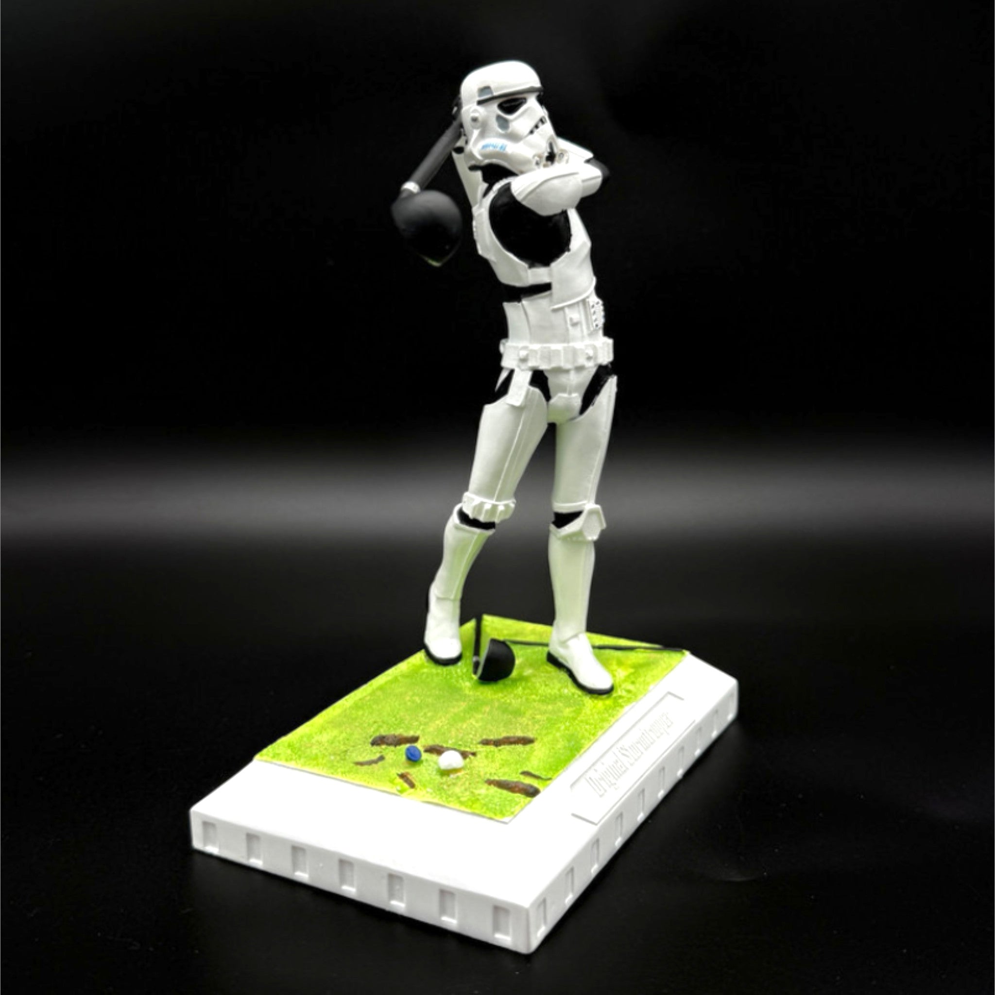 Stormtrooper golf figurine mid-swing side view