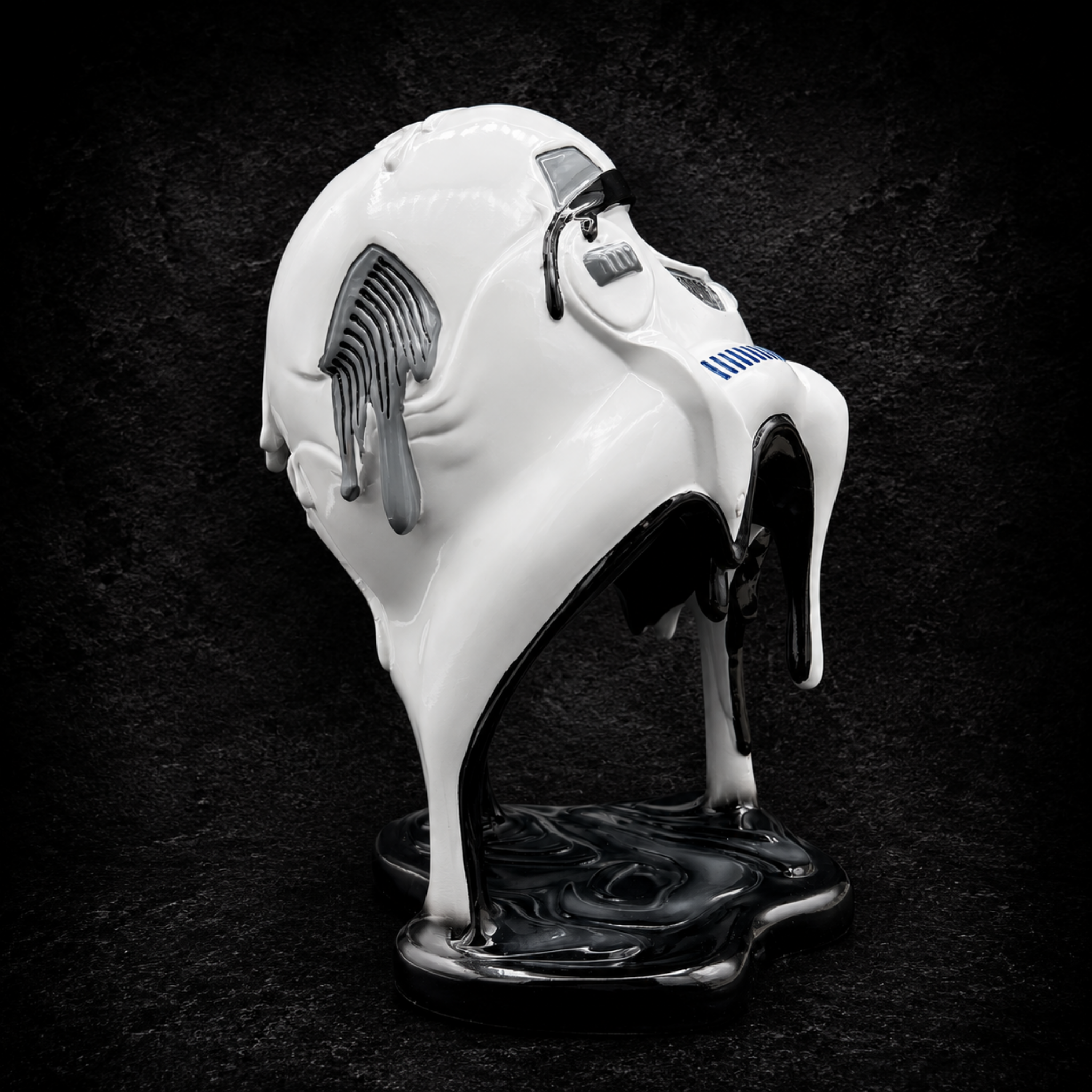Side view of the Stormtrooper Too Hot To Handle ornament featuring the melting helmet detail and sculpted resin base