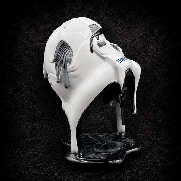 Side view of the Stormtrooper Too Hot To Handle ornament featuring the melting helmet detail and sculpted resin base
