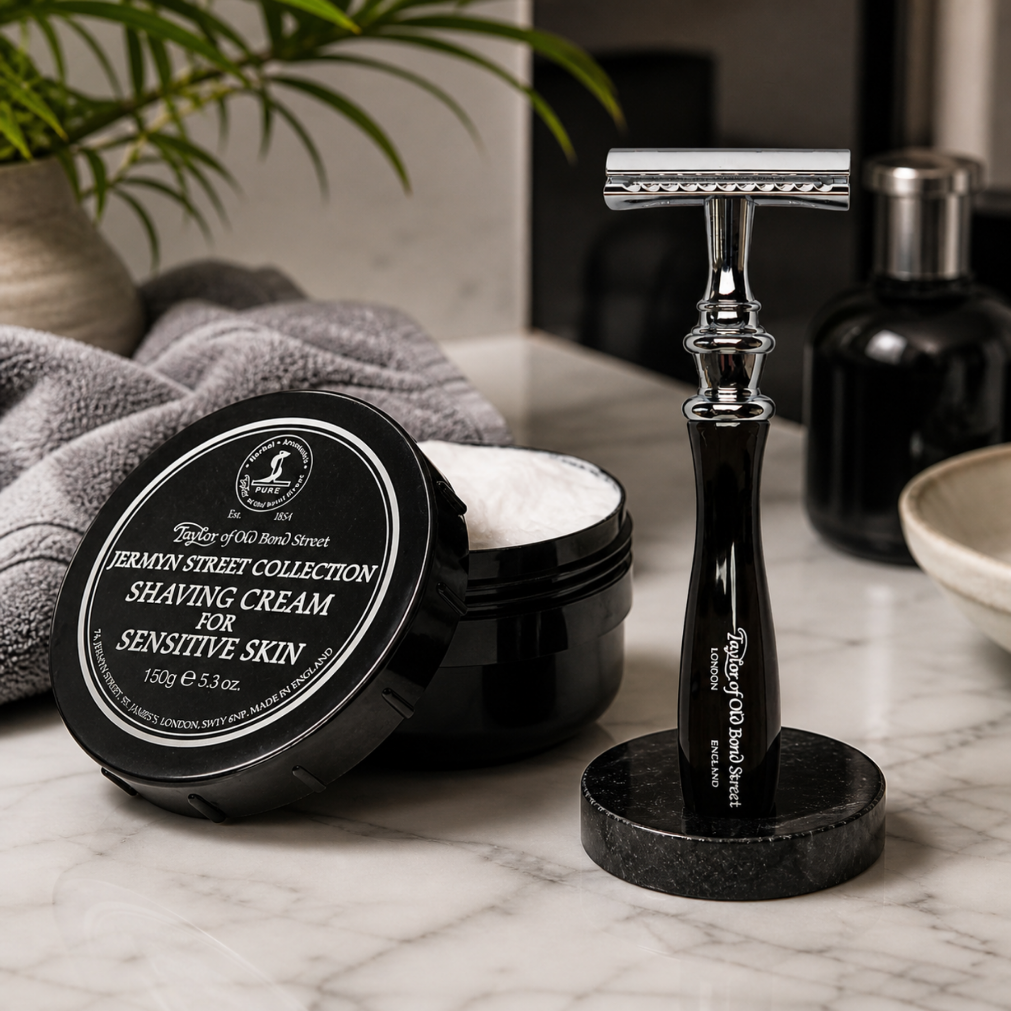 Taylor of Old Bond Street Jermyn Street shaving cream with traditional safety razor in luxury bathroom setting