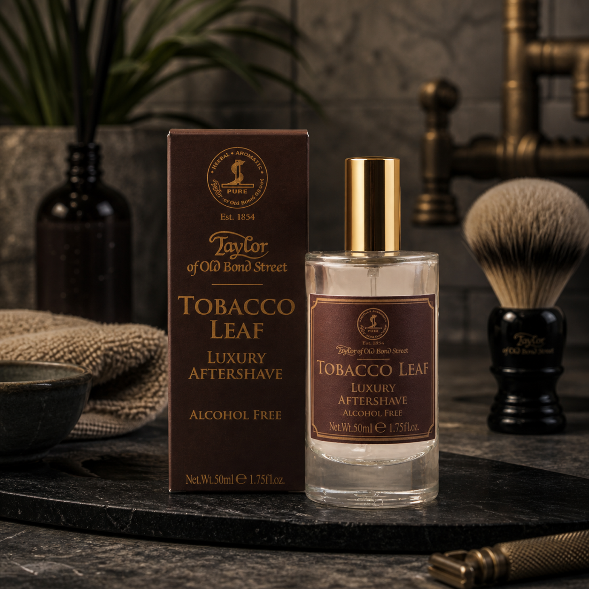 Taylor of Old Bond Street Tobacco Leaf aftershave in a luxury masculine grooming scene with shaving brush and dark stone textures