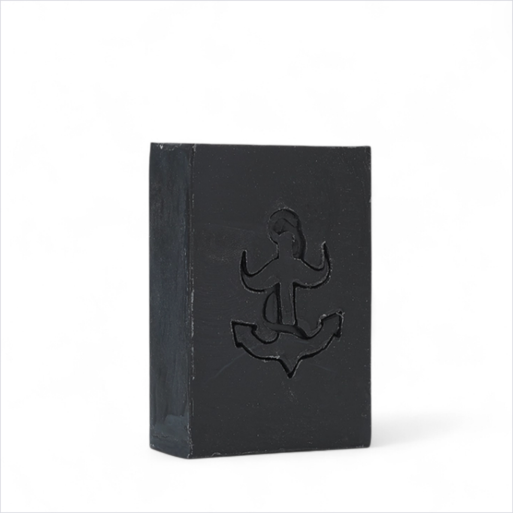 The Brighton Beard Co. The Miller’s Beard Shampoo Bar 100g black soap bar with anchor detail on white background