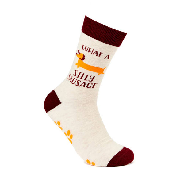 Novelty socks with what a silly sausage slogan and dog design on white background
