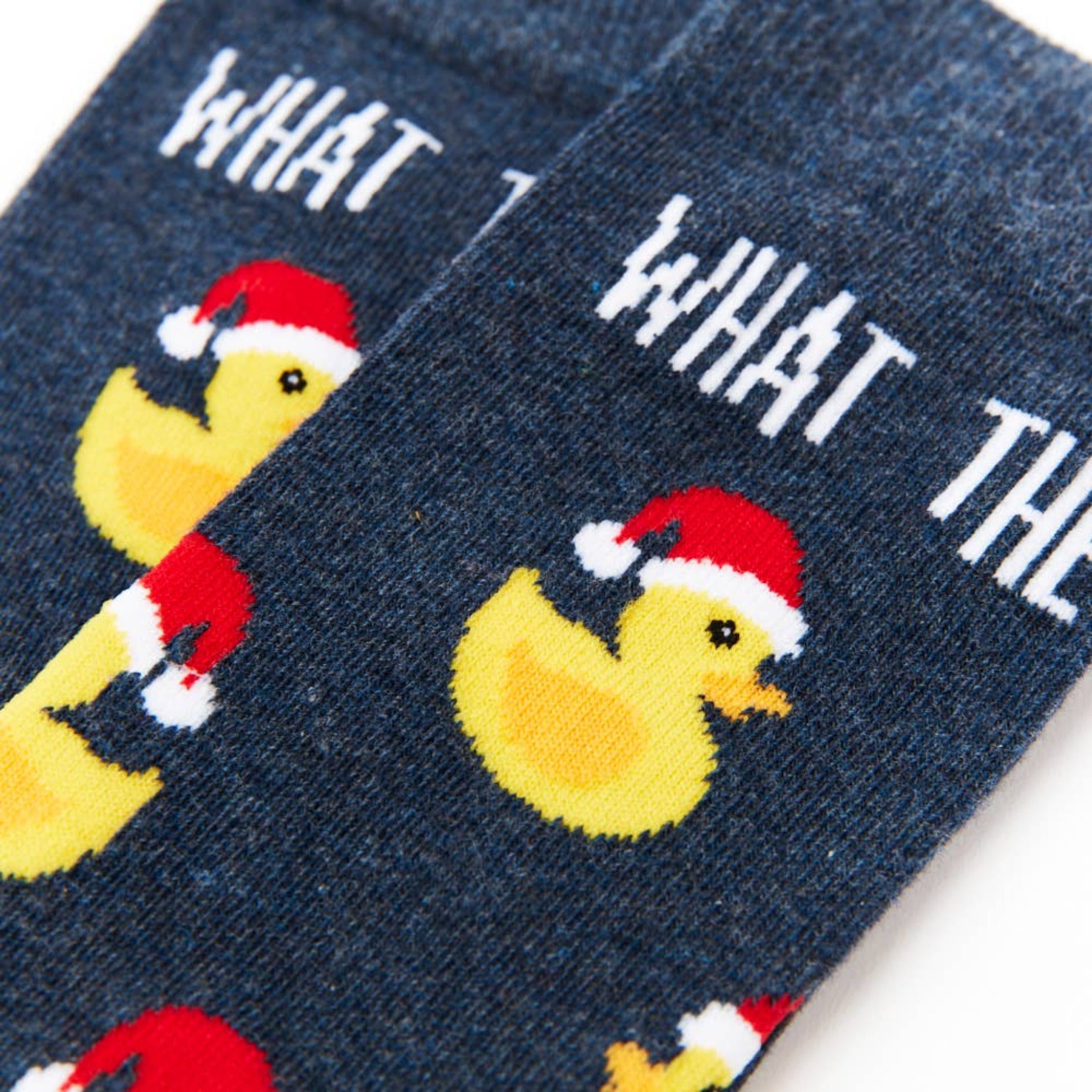 close up of What The Duck socks showing duck pattern and text