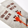 close up of Wind Your Neck In socks showing giraffe design and text